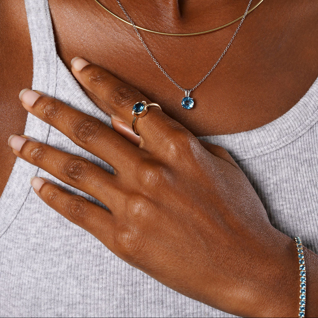 Natural Blue Topaz and Claw Lab Grown Diamond Ring