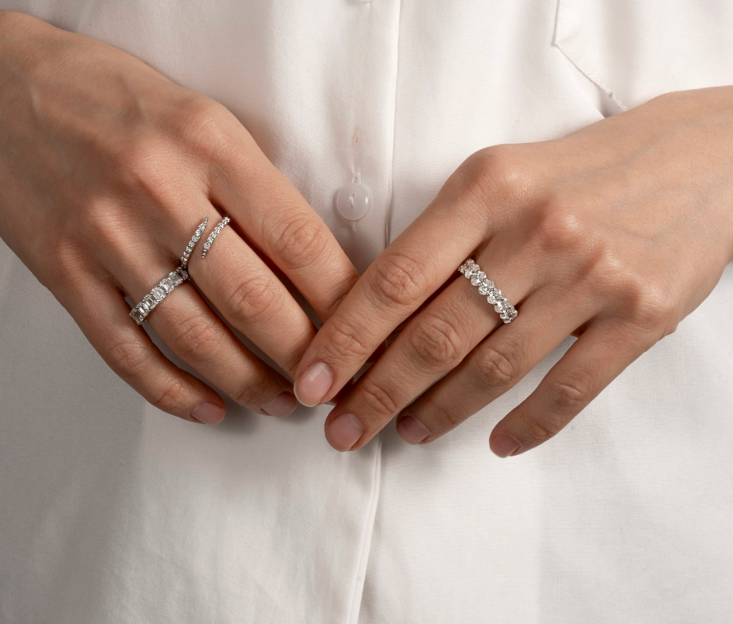 Natural diamond stacking rings styled with a soft neutral manicure