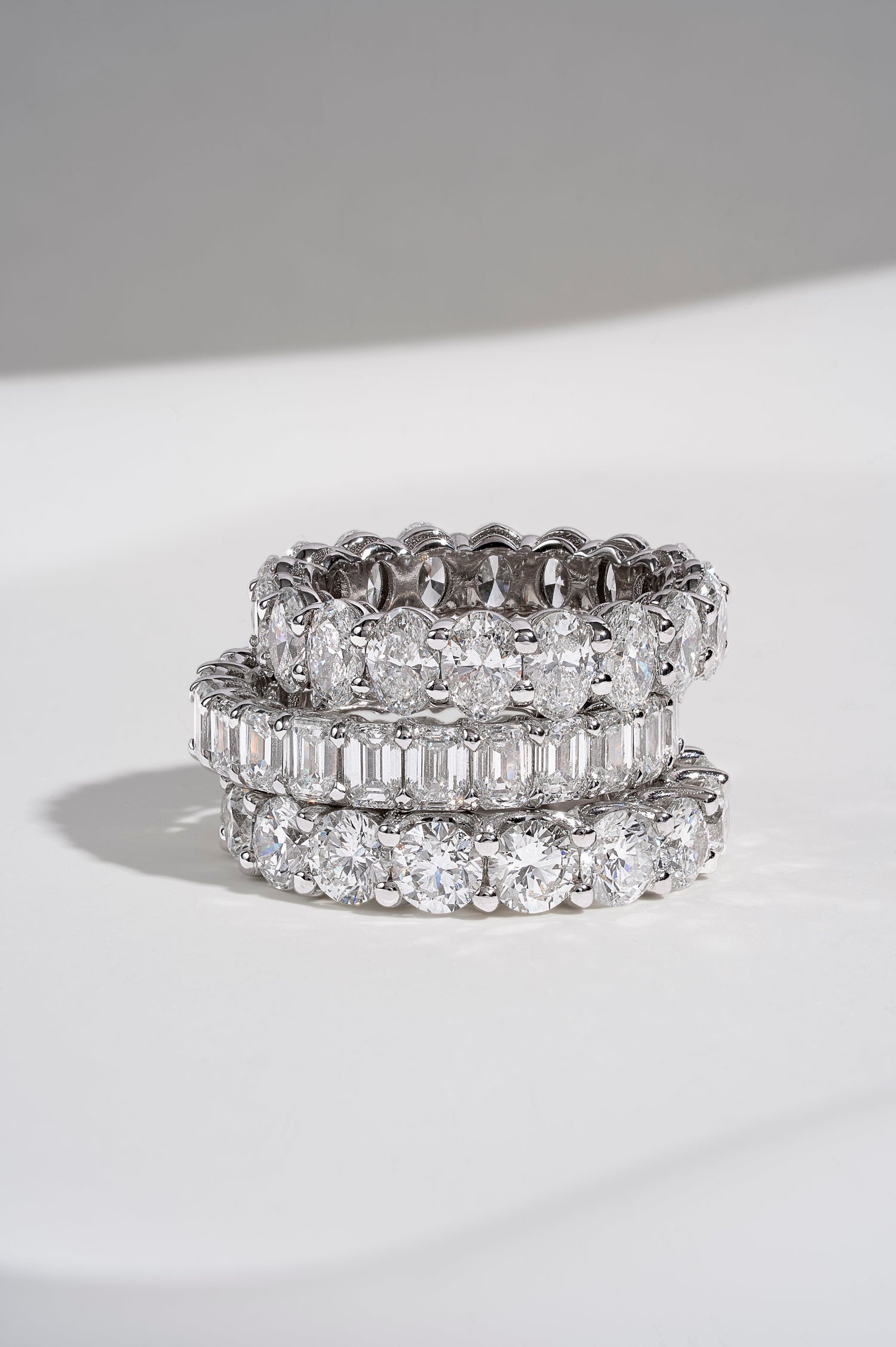 Natural diamond stacking rings styled with a soft neutral manicure