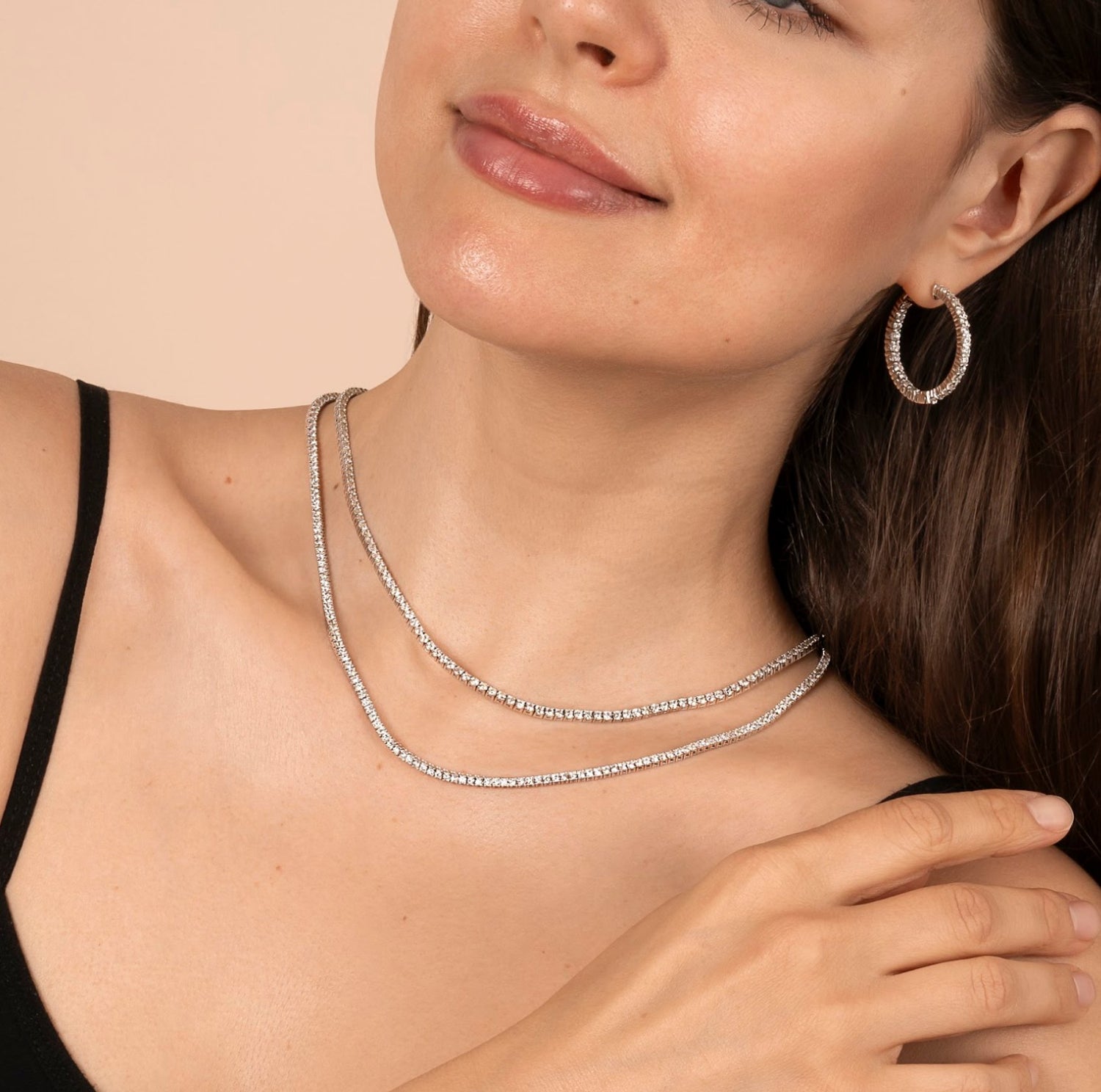 Woman’s wrist adorned with a sleek diamond bracelet, perfect for daily wear